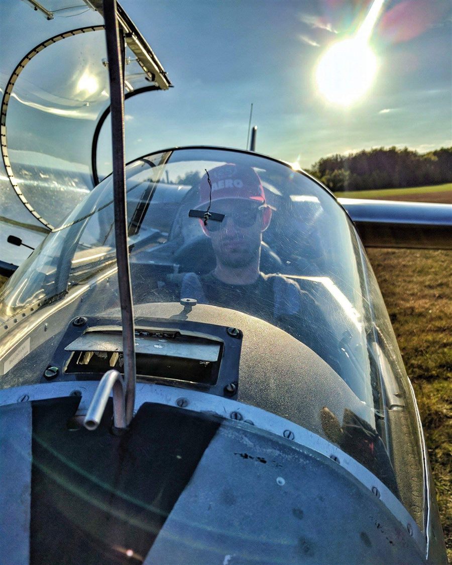 Julius Bartaševičius in a glider cockpit at sunset